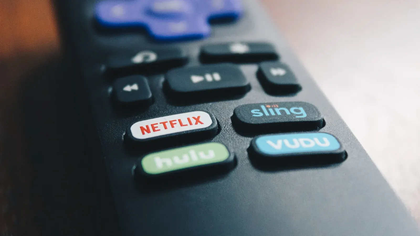 Close-up of a streaming remote control with app shortcut buttons