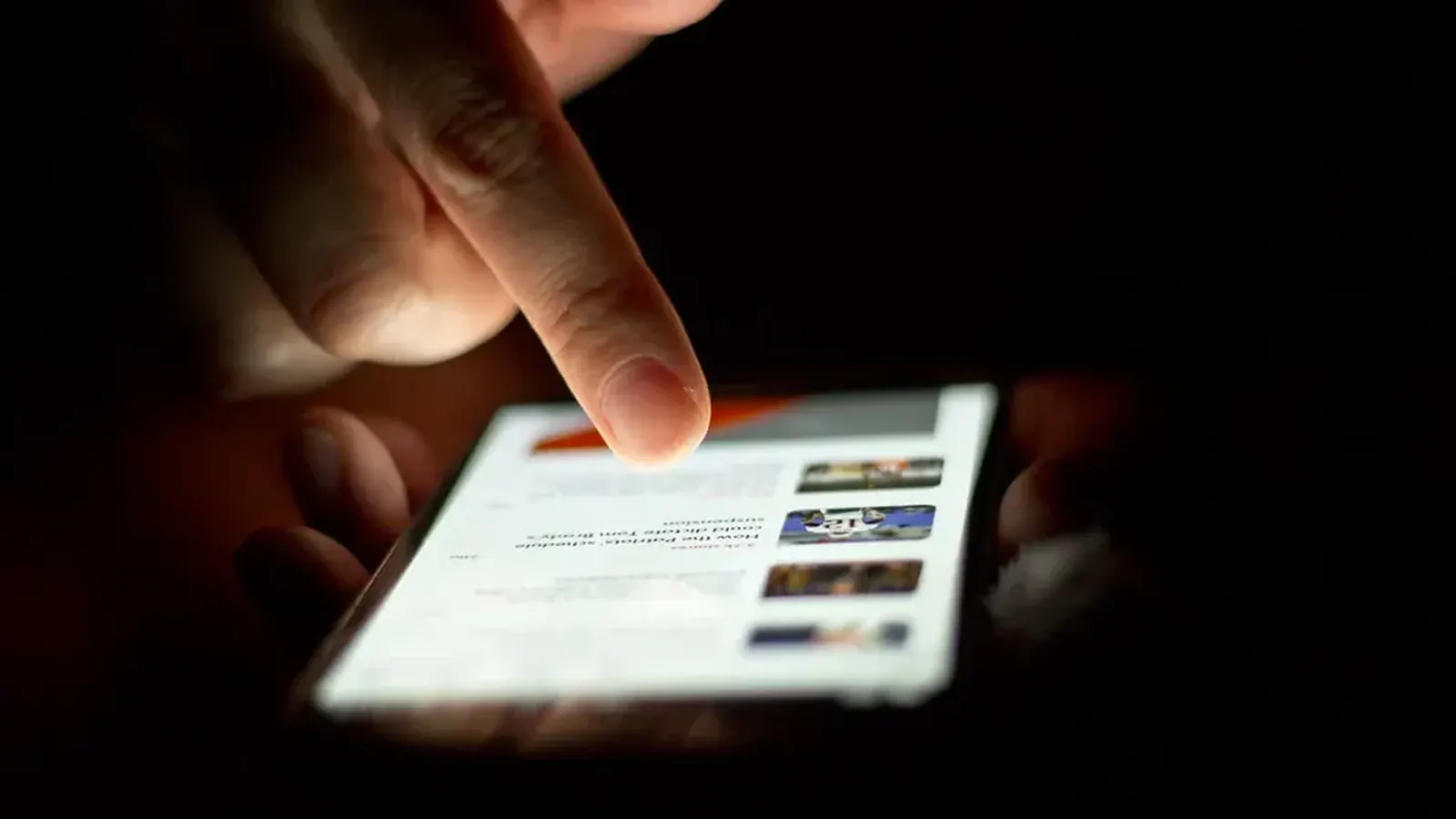 Close-up of a hand scrolling through an app on a smartphone